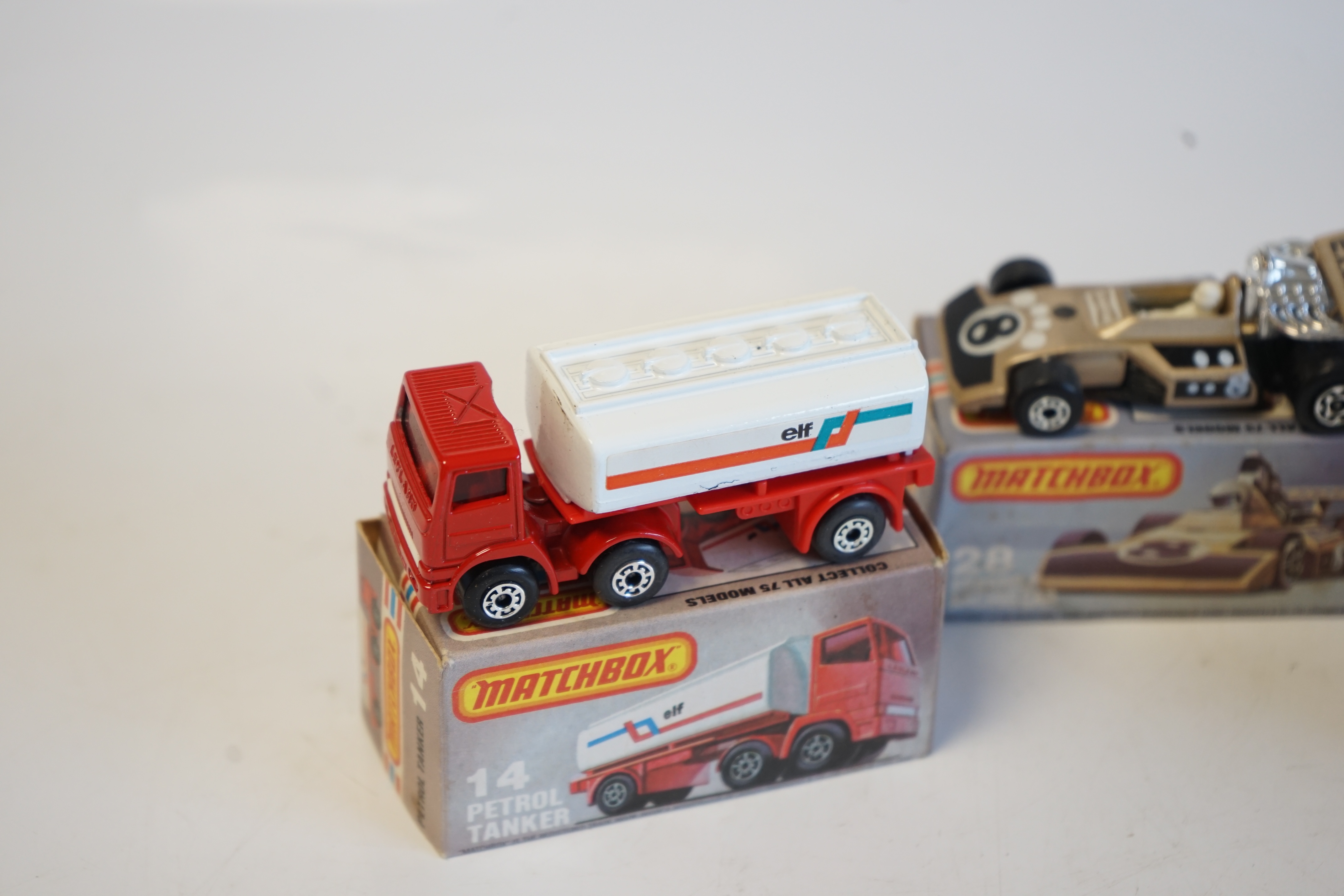 Seventeen boxed Matchbox Series 1-75 diecast vehicles including; 6; Mercedes Tourer, 9; Ford RS 2000, 10; Plymouth Police Car, 14; Petrol Tanker, 28; Formula One Racing Car and another, 30; Artic Truck, 30; Swamp Rat, 35